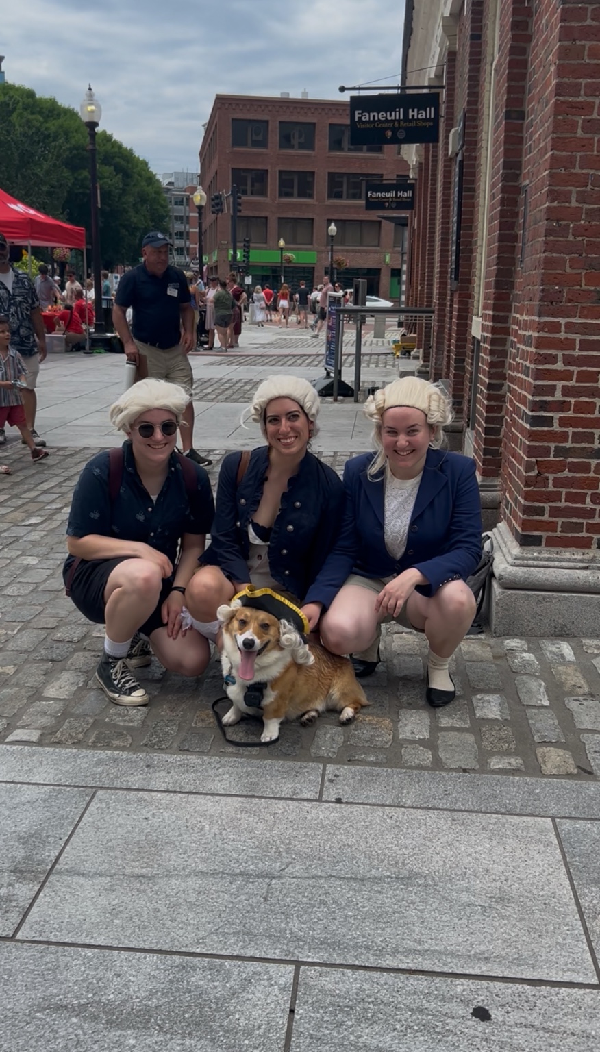 Rocko with three women in colonial wigs at Faneuil Hall